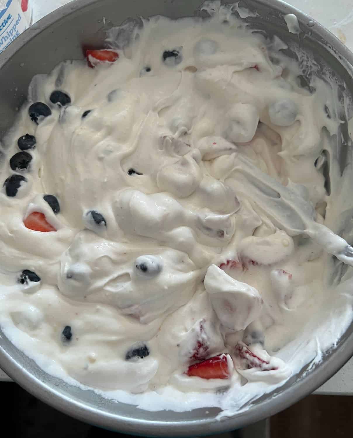 Berries combined with cheesecake pudding mixture. 