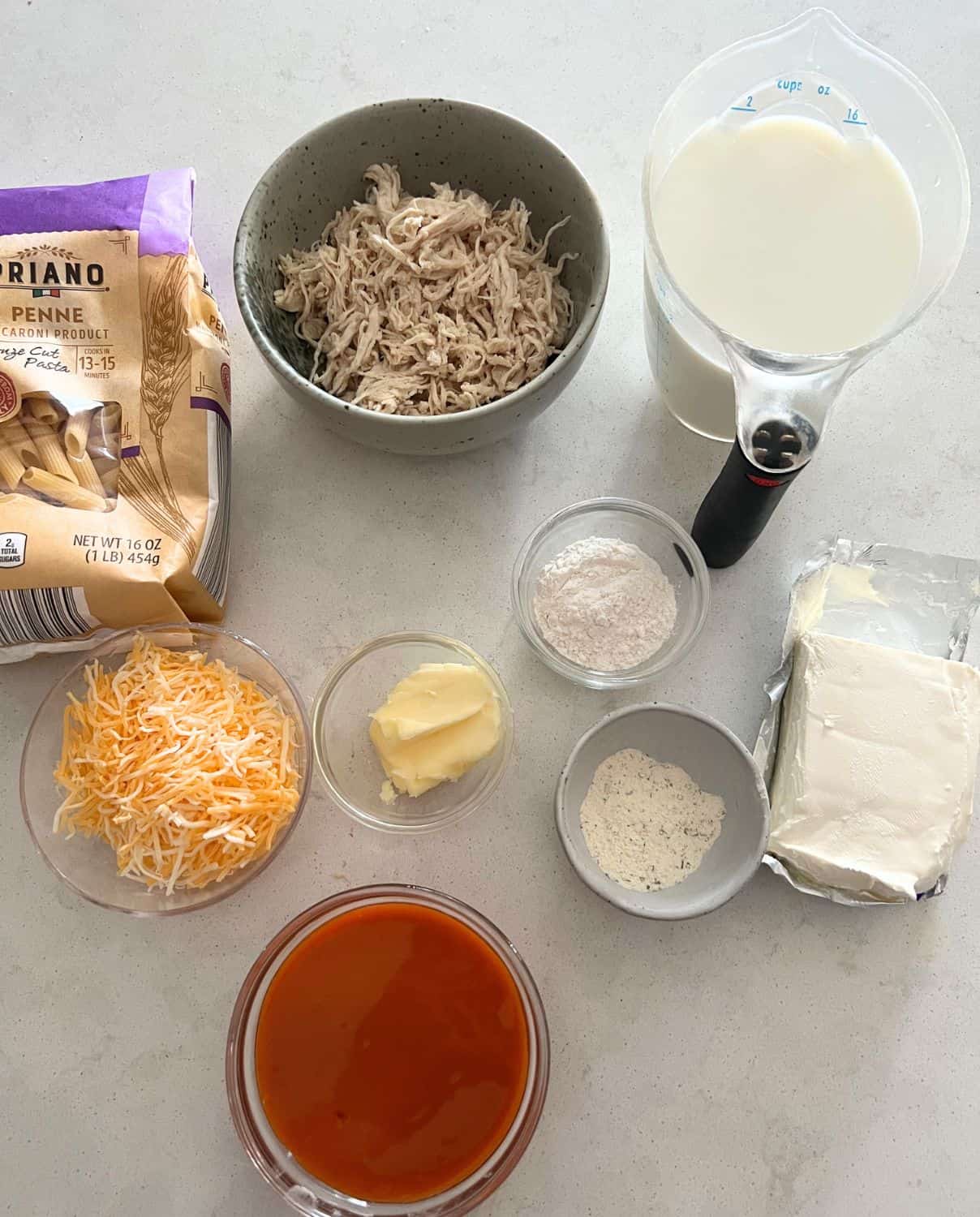 Ingredients needed for buffalo chicken baked ziti. 