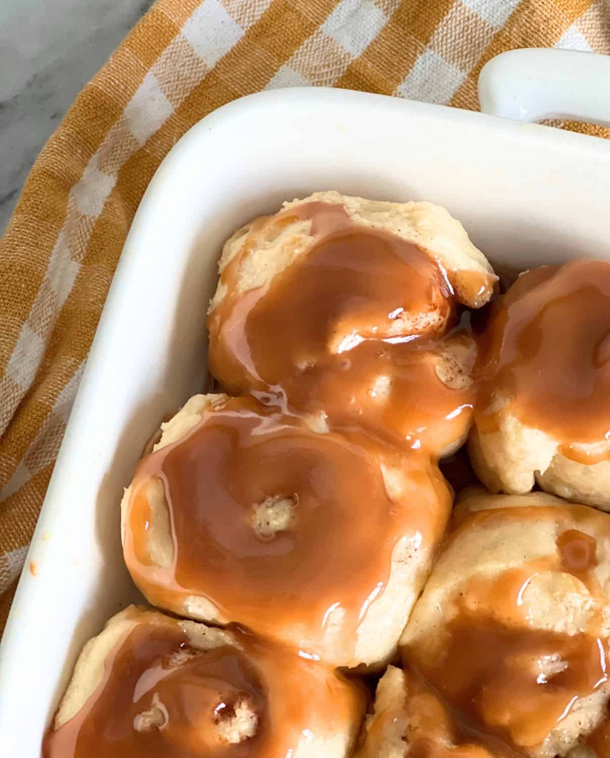 Caramel cinnamon rolls topped with sugar-free caramel topping.