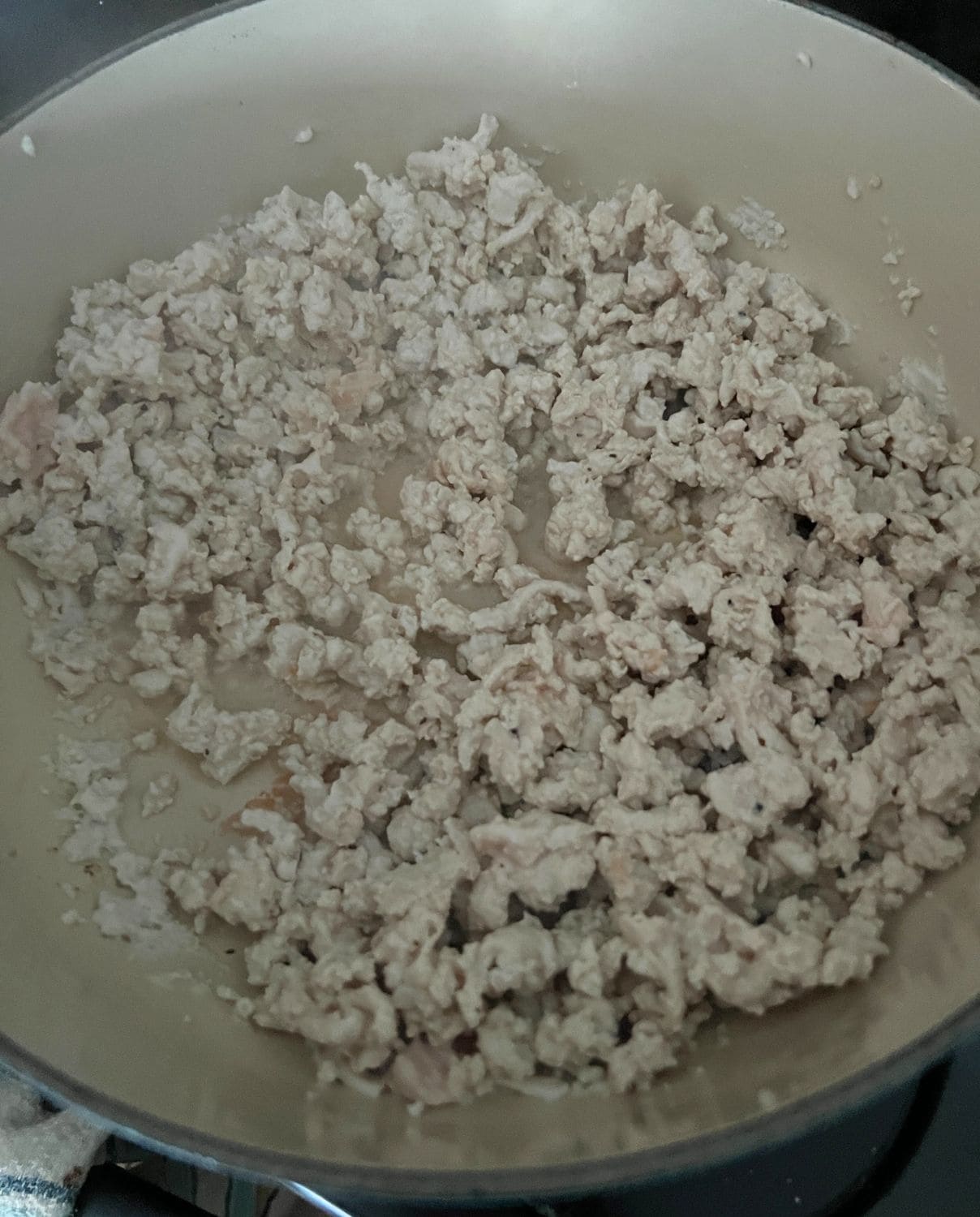 Ground turkey cooking in a pan. 