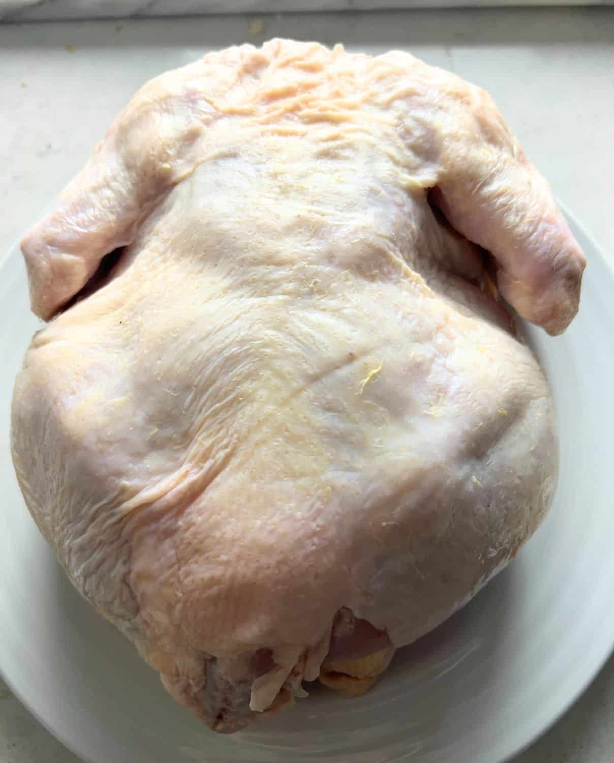 One patted dry whole chicken ready for air fryer. 