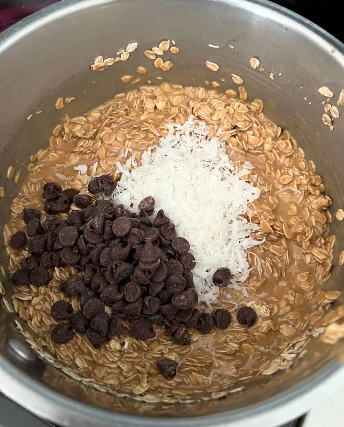 Oats, chocolate chips, and coconut mixed with peanut butter. 