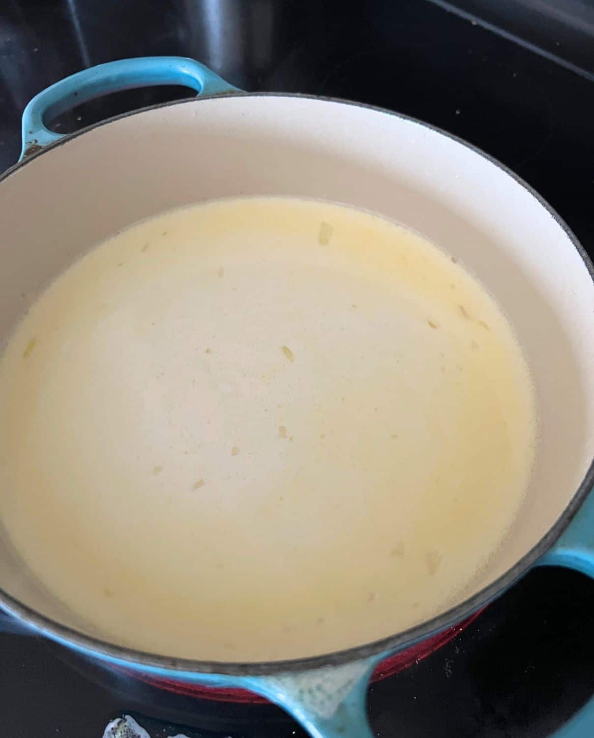 Milk, broth, and butter mcombined in a sauce pan. 