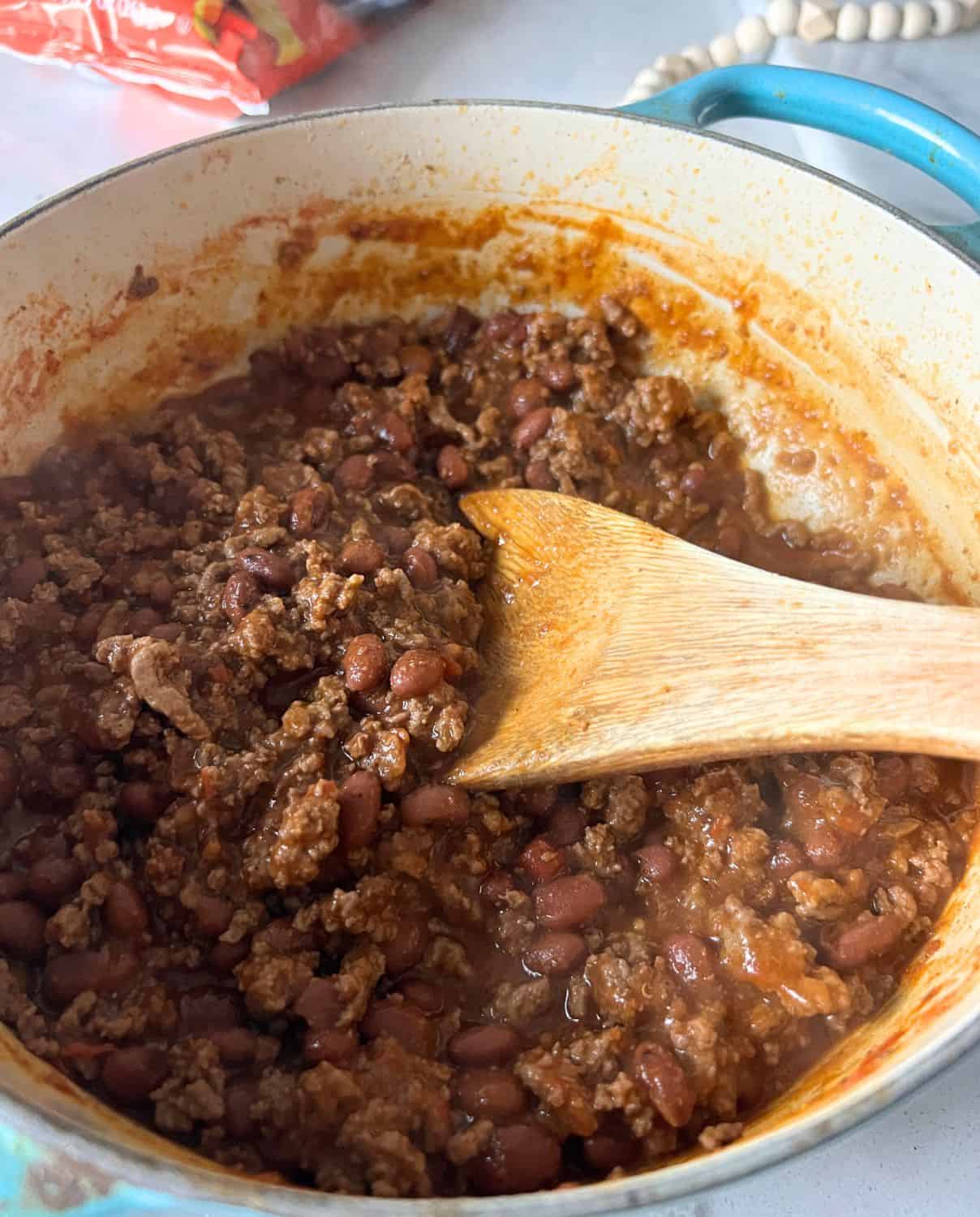 Finished beef chili with beans in a dutch oven. 