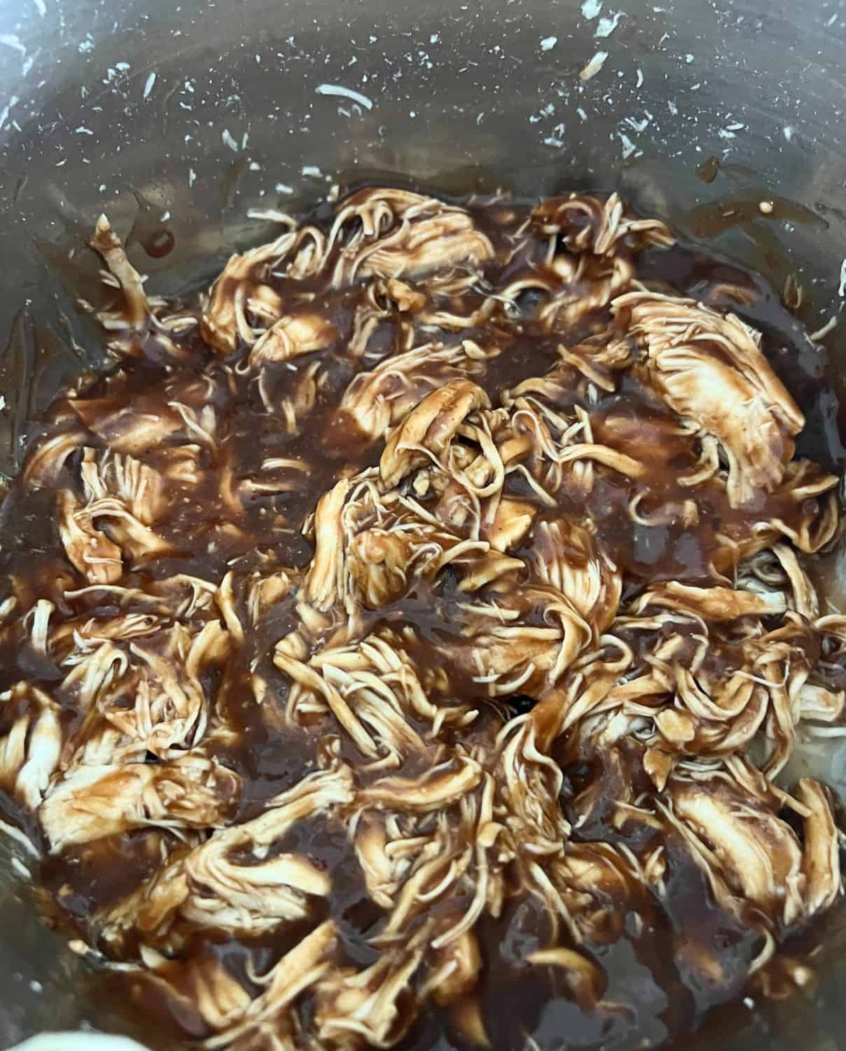 Shredded chicken with BBQ sauce in Instant Pot.
