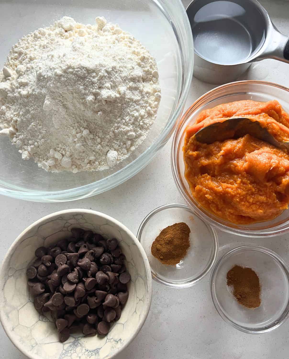 Ingredients needed for pumpkin muffins with chocolate chips. 