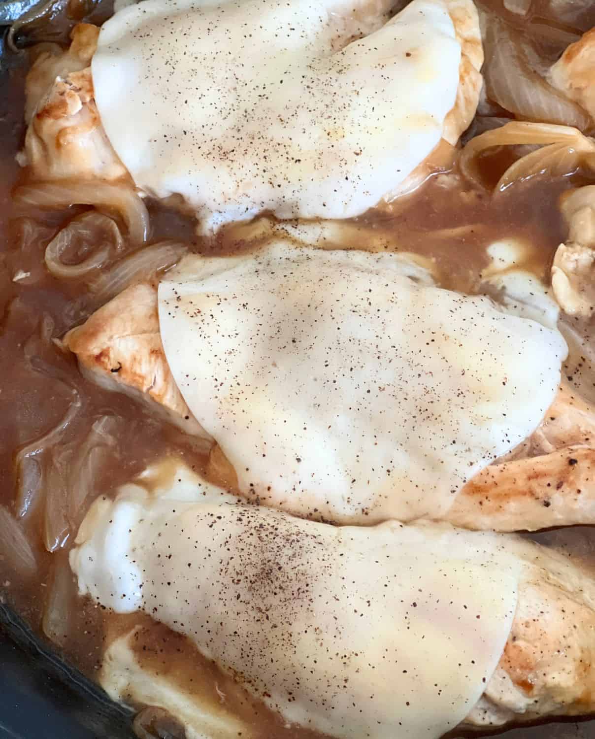 Finished french onion chicken topped with cheese.