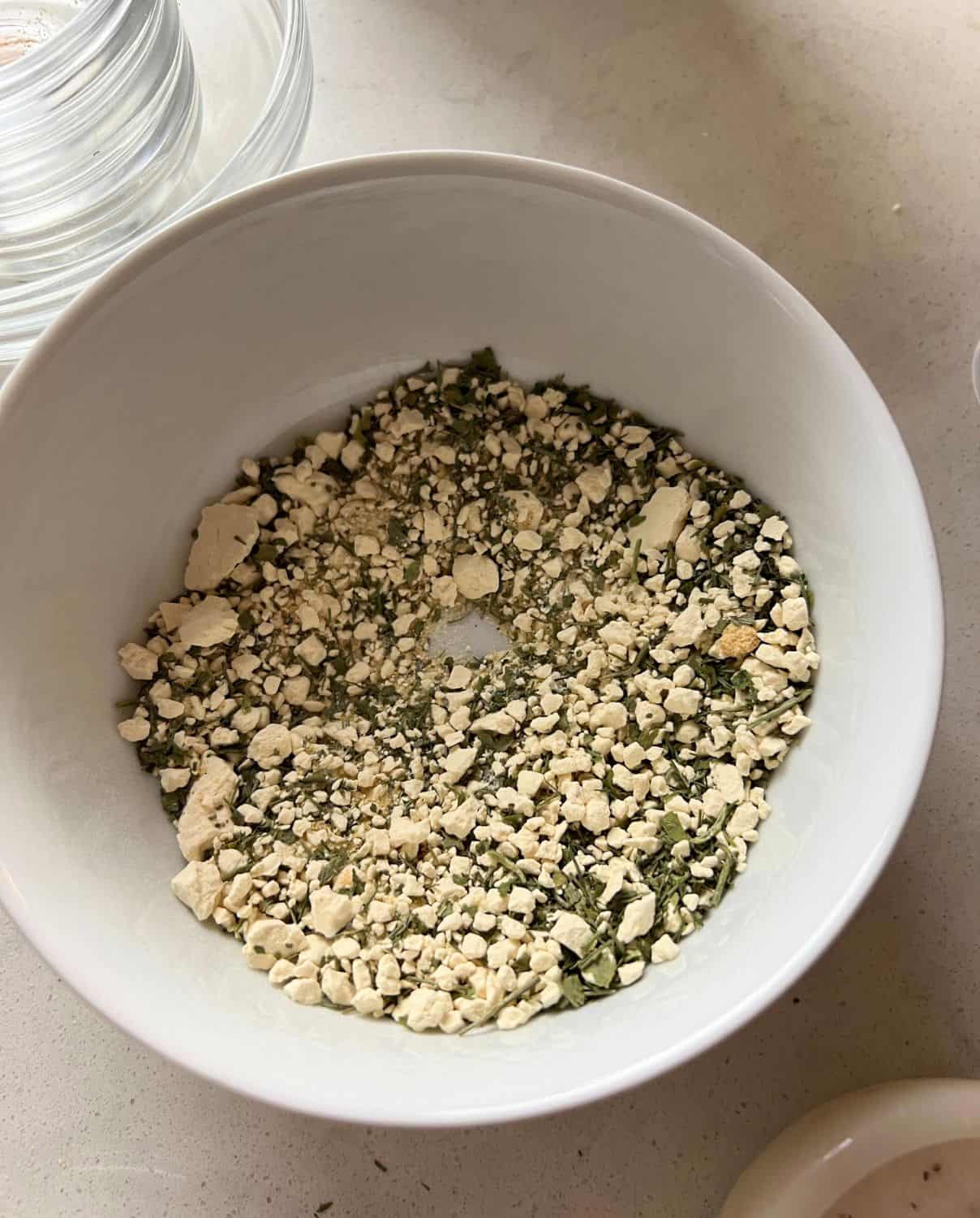 Dry ingredients for ranch dressing mixed in a bowl. 