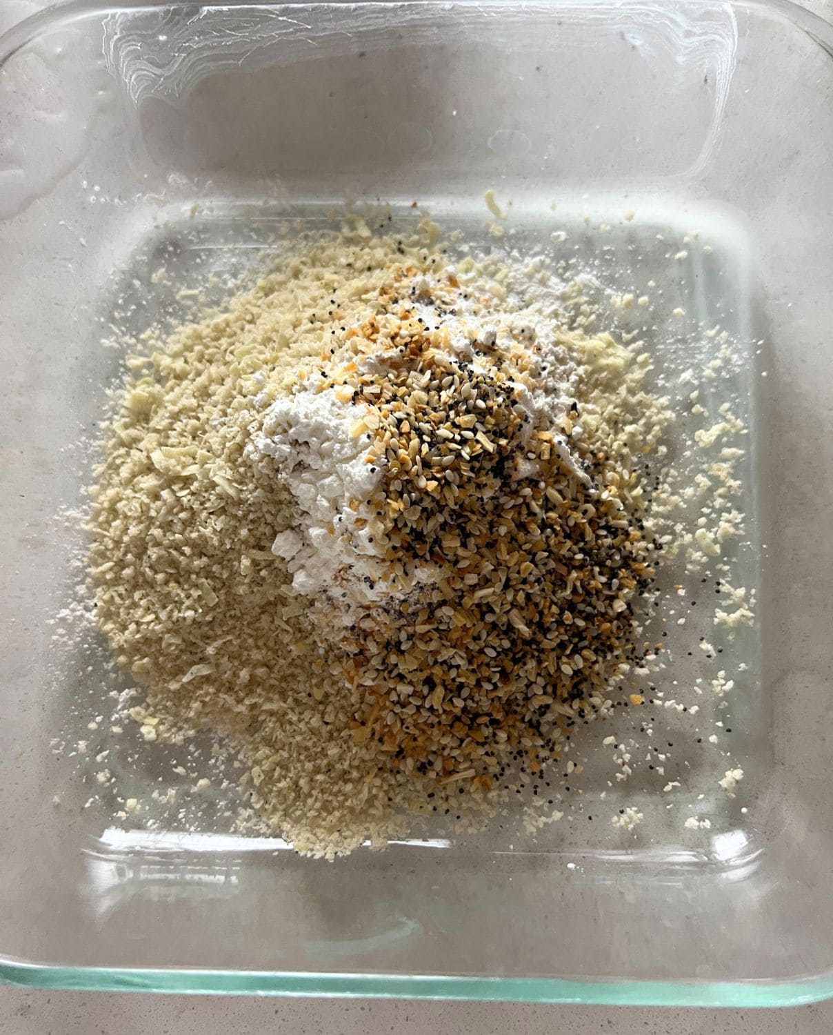 Seasonings and Everything Bagel seasoning mixed in a shallow dish. 