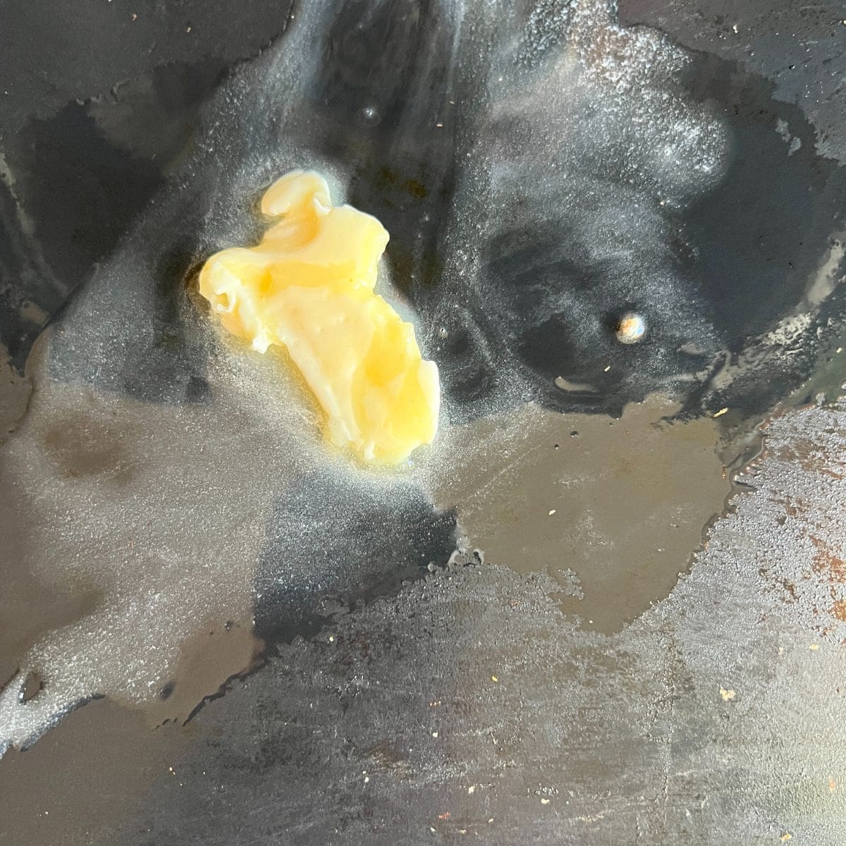 Melted butter on a Blackstone Griddle. 