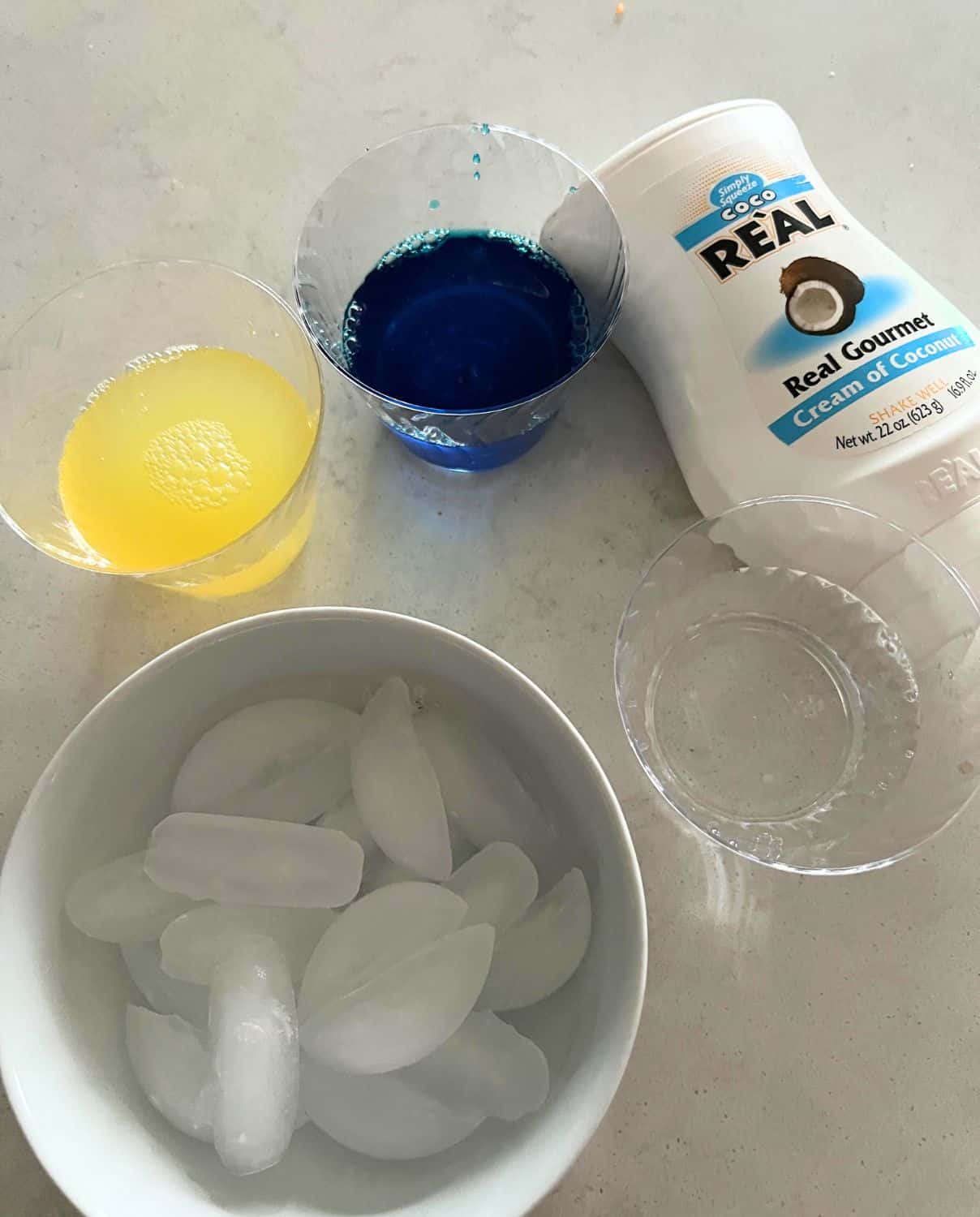 Ingredients needed for Blue Hawaiian Cocktail. 
