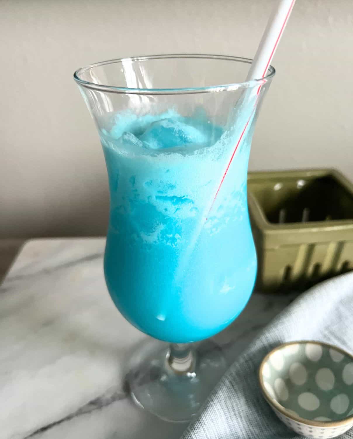 Blue hawaiian cocktail in a tall glass. 
