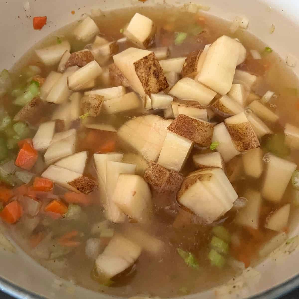 Potatoes added with chicken broth and water. 
