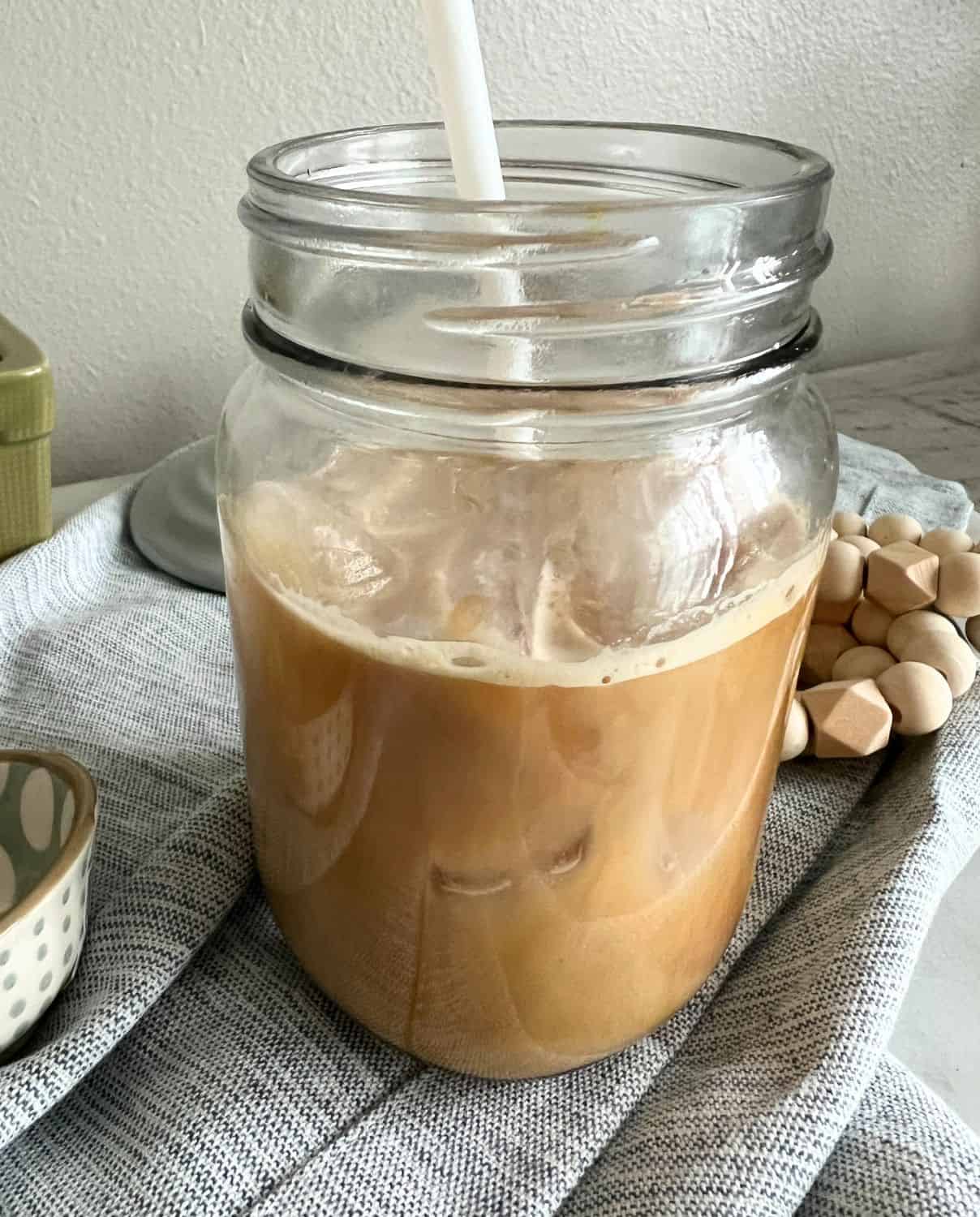 Sugar Cookie Latte with Sugar Cookie Syrup in a glass jar. 