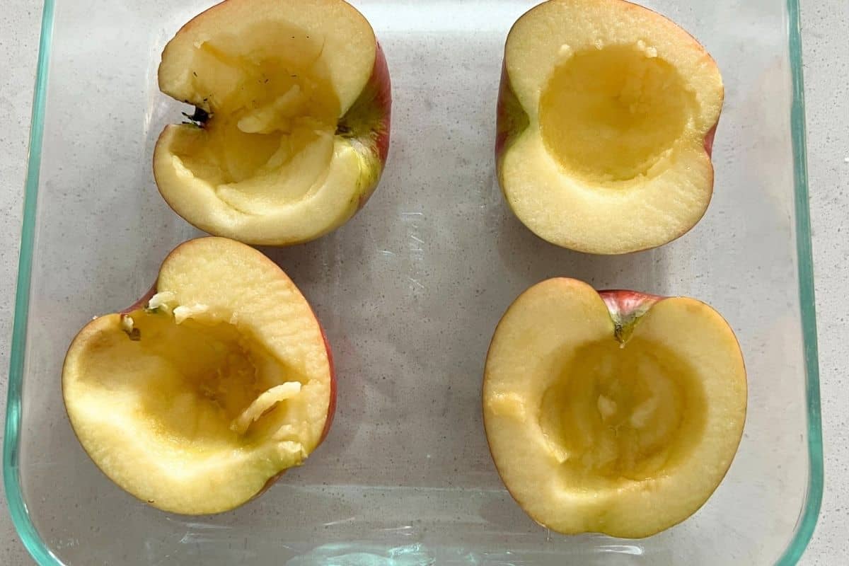 4 apple slices with insides scooped out of the middle.
