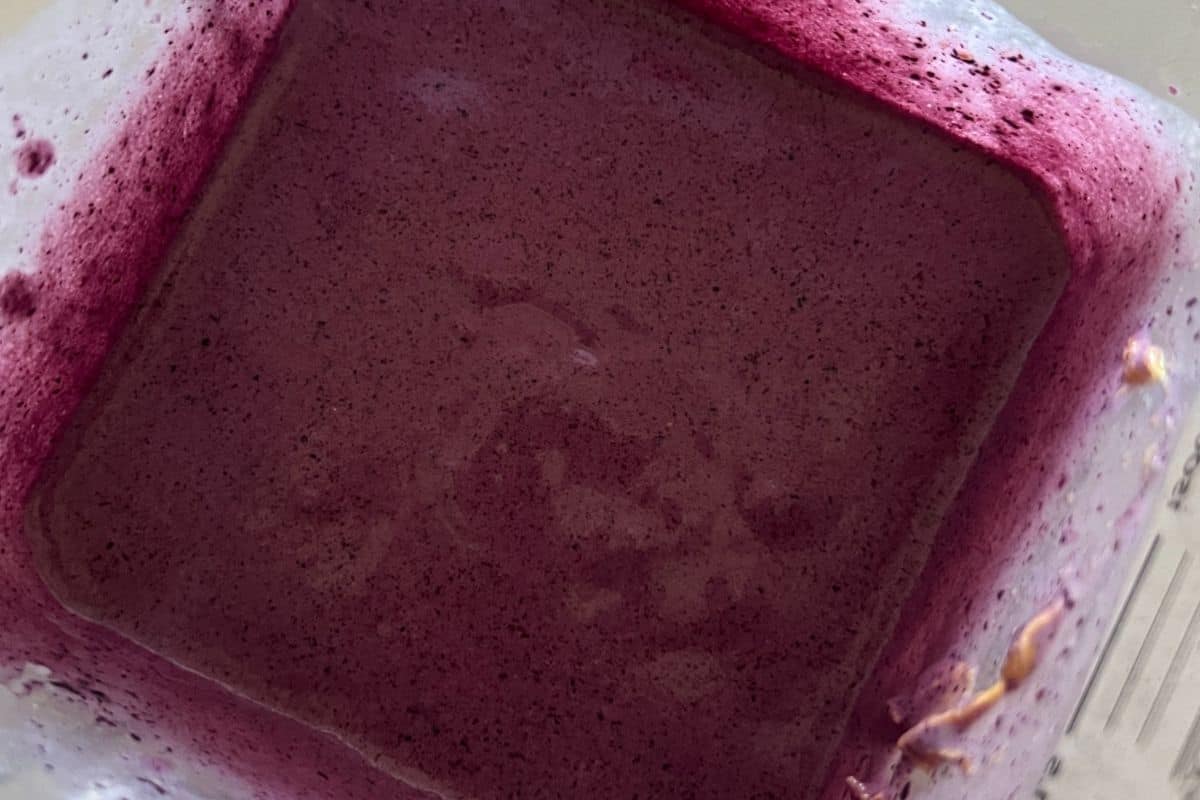 Blueberry smoothied blended together in a blender. 