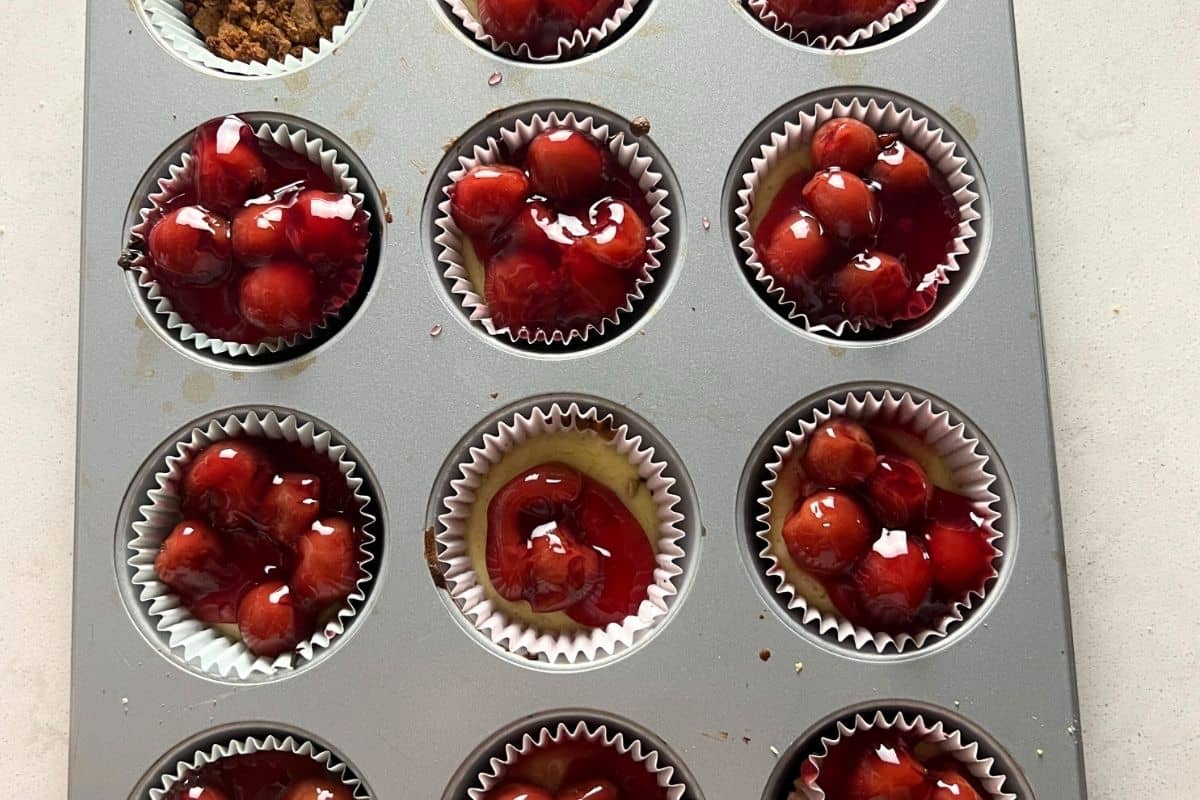 Mini Cheesecakes topped with cherries. 