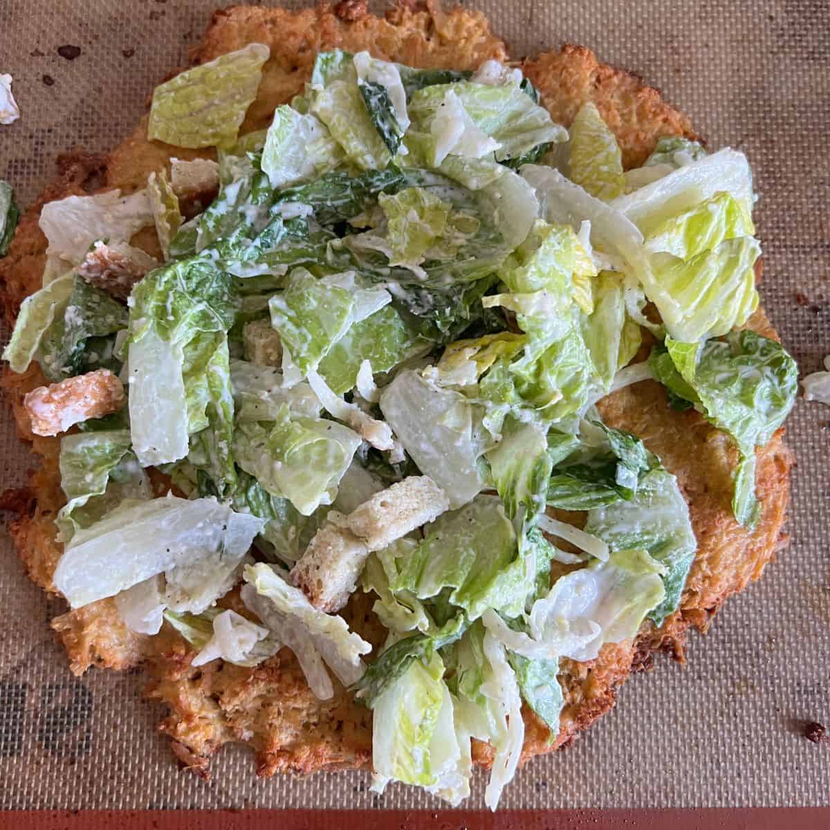 This chicken crust pizza is made with 4 easy ingredients and they are canned chicken, egg, parmesan cheese, and bread crumbs. 