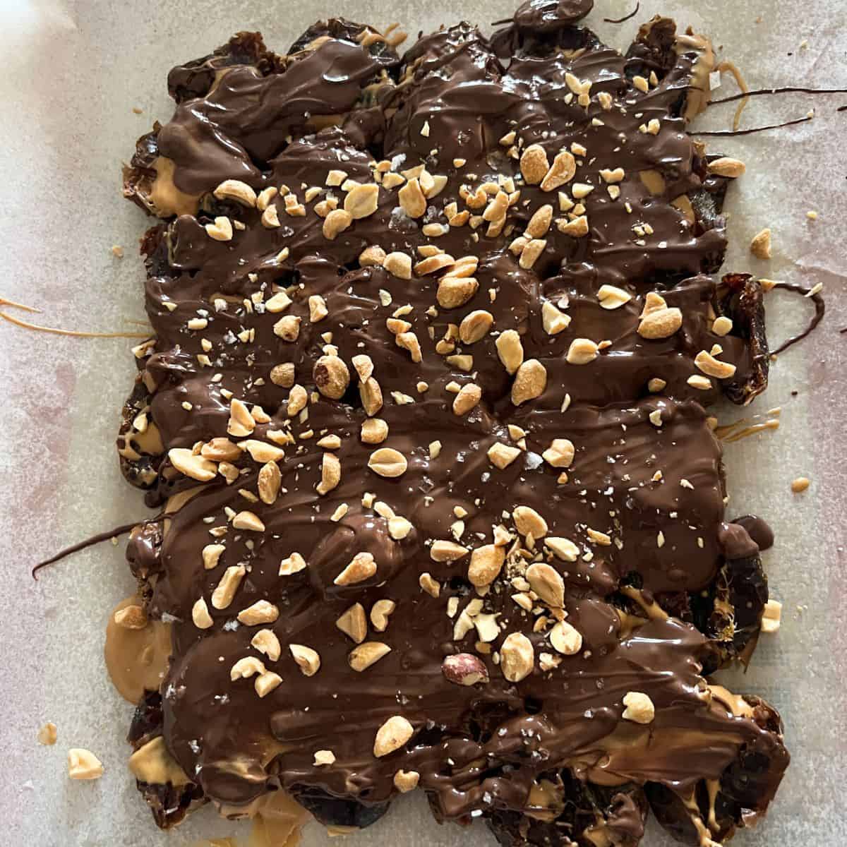 This viral snicker date bark are stuffed with creamy peanut butter and get drizzled in chocolate