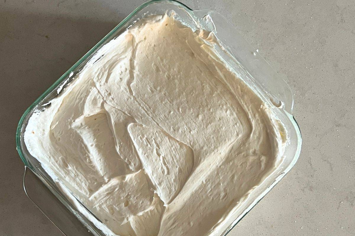 Cool whip and cream mixture spread onto cooled pretzel crust.