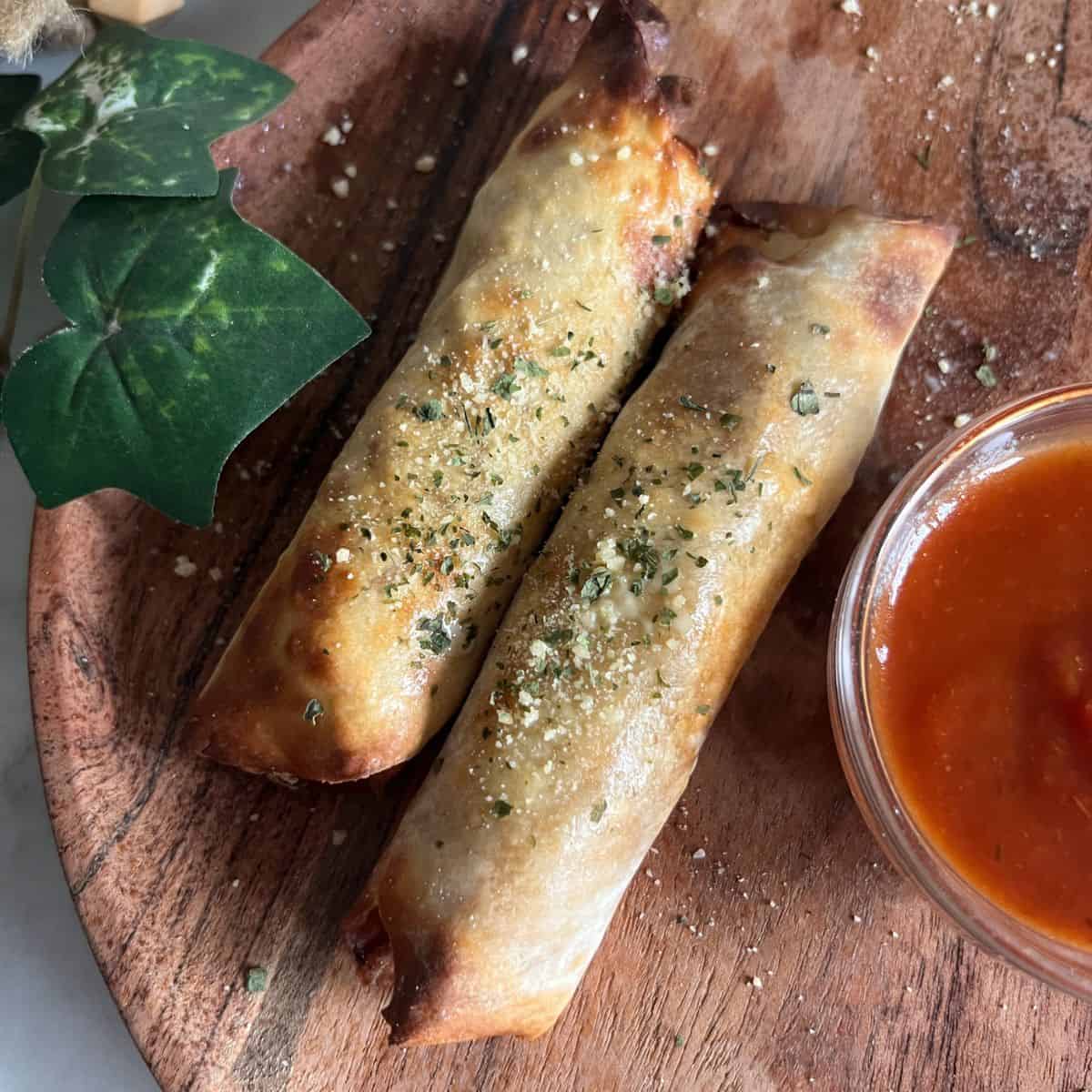  These homemade egg rolls are stuffed with turkey pepperoni and mozzarella string cheese.