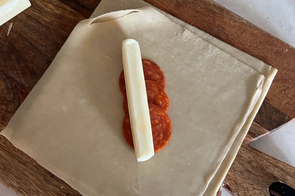 Pepperoni and string cheese on wonton or egg roll wrapper. 