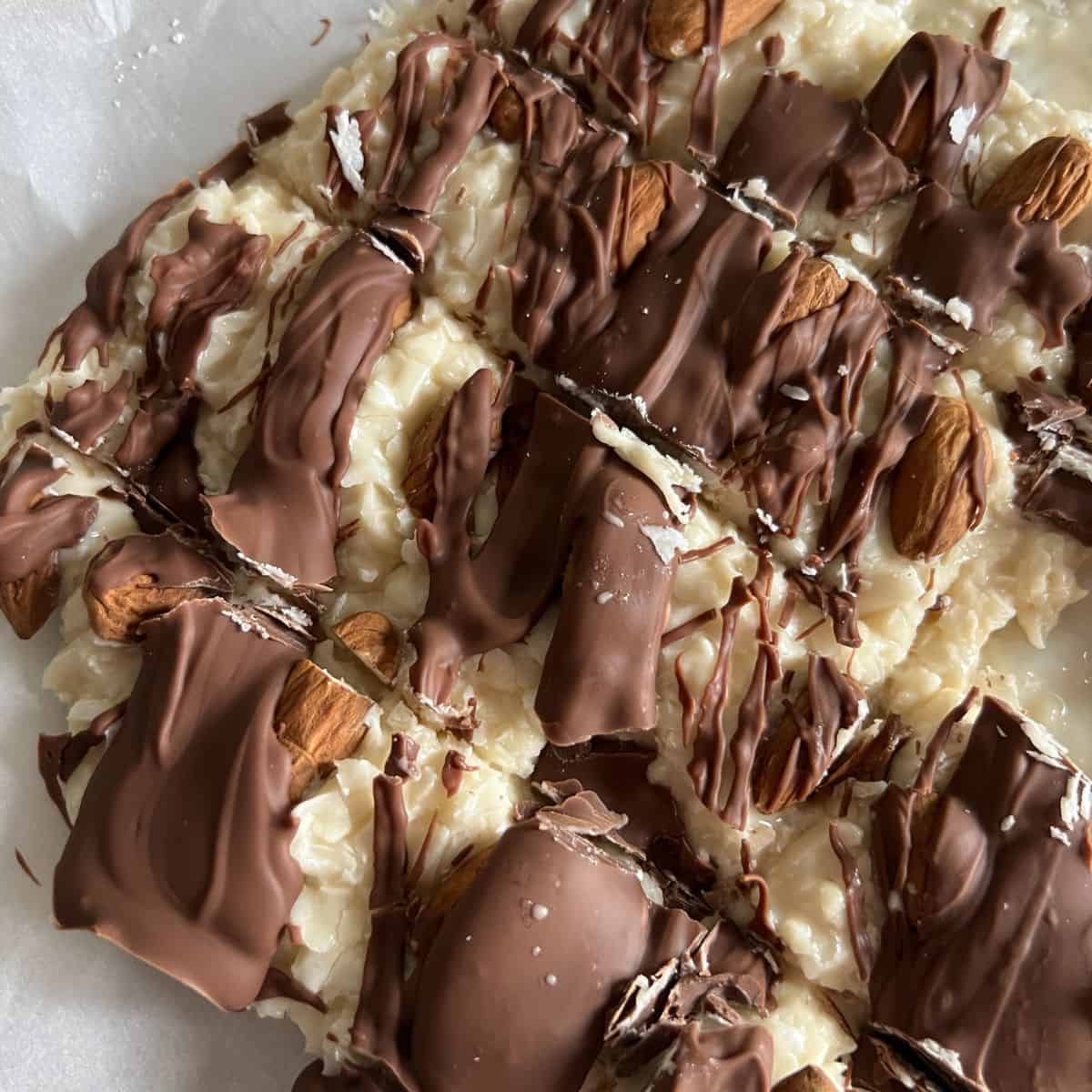 Homemade almond joy bars drizzled with chocolate. 