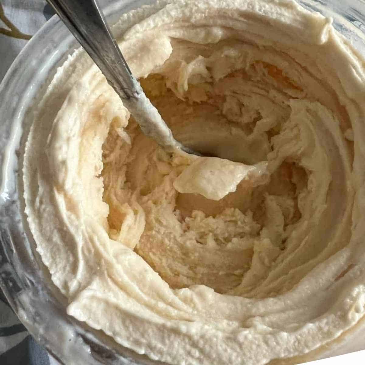 Ninja Creami Vanilla Ice Cream in a clear pint container.