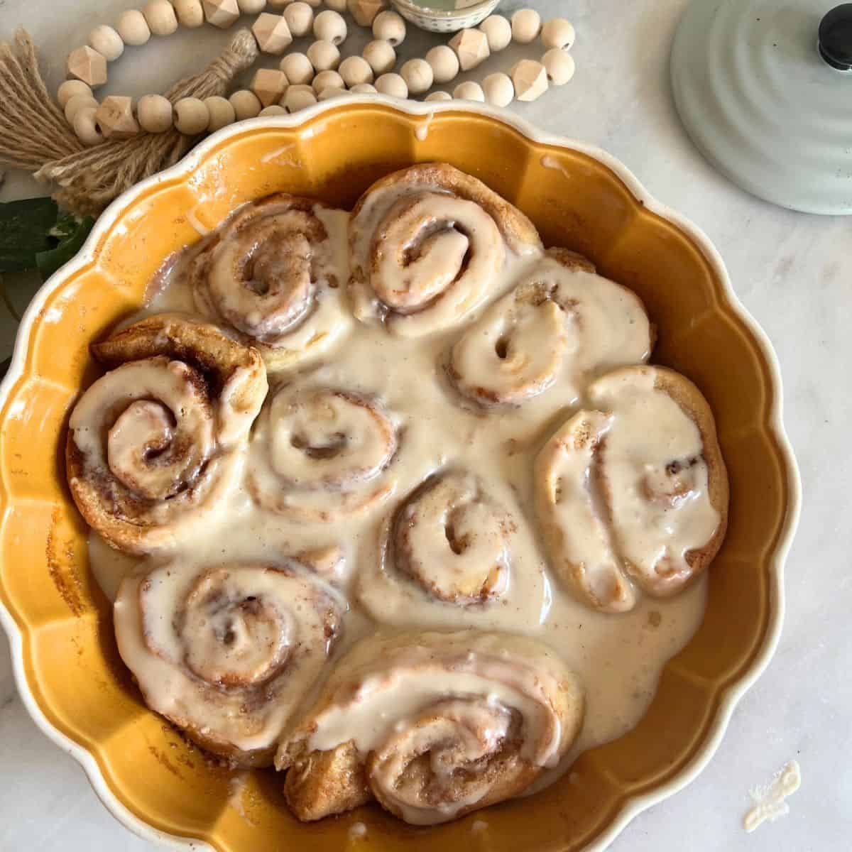 Pioneer Women's Cinnamon Rolls topped with maple glaze frosting.