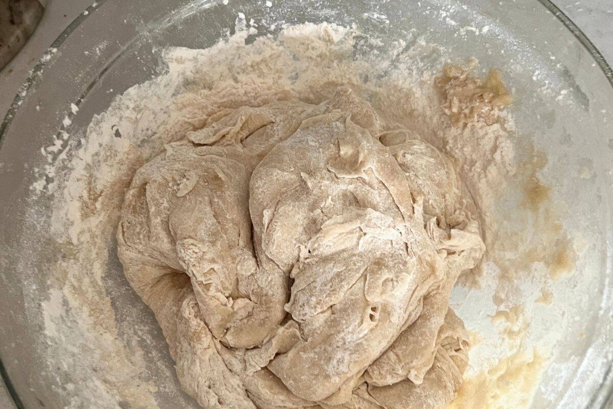 Dry ingredients combined with wet ingredients in a bowl.