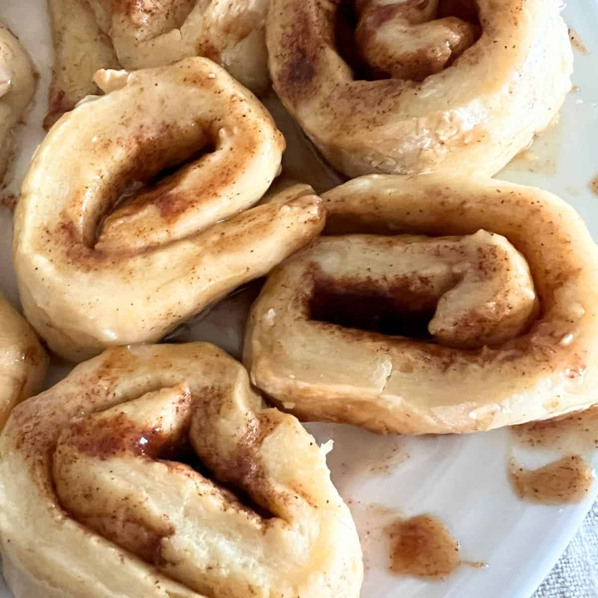 This cinnamon roll recipe is made with the famous 2 ingredient dough recipe is equal parts Greek Yogurt and Self Rising Flour