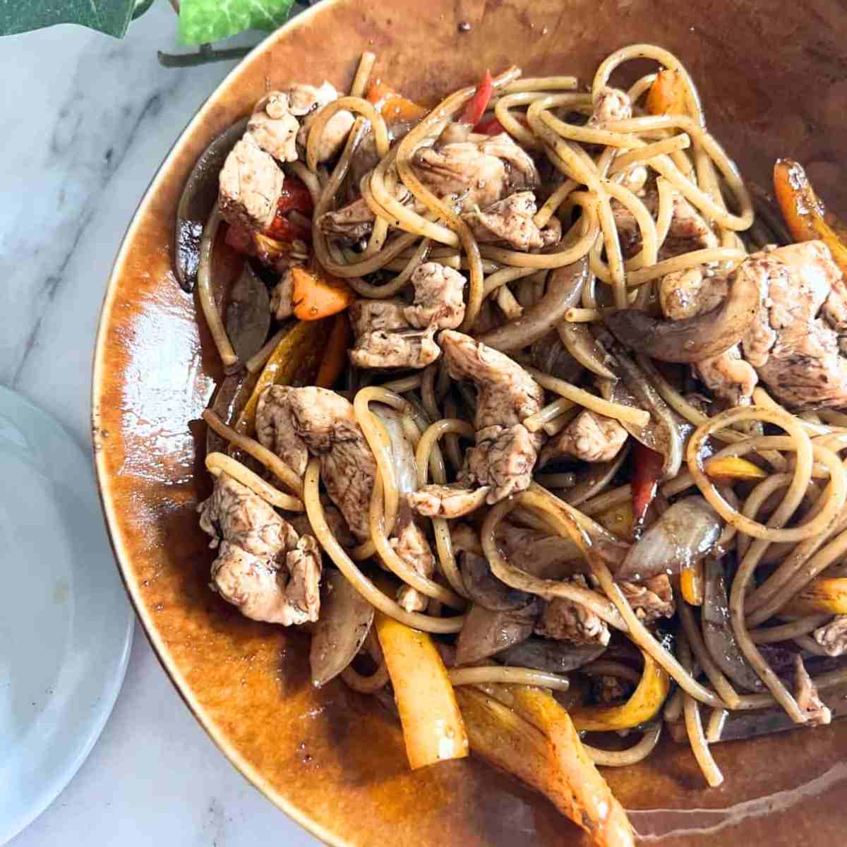Blackstone Lo Mein served in a brown bowl.