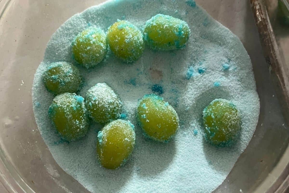 Grapes coated in gelatin mixture. 