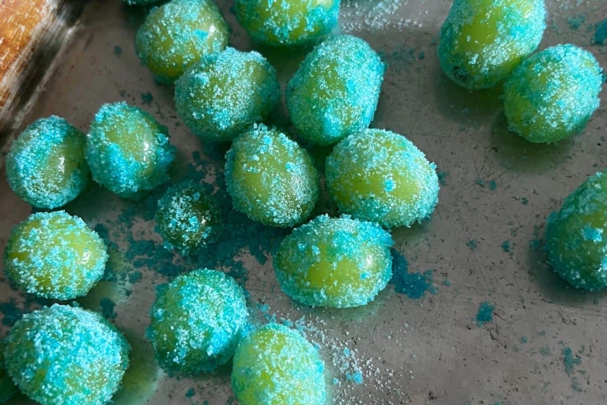 Grapes coated in sugar on a sheet pan. 