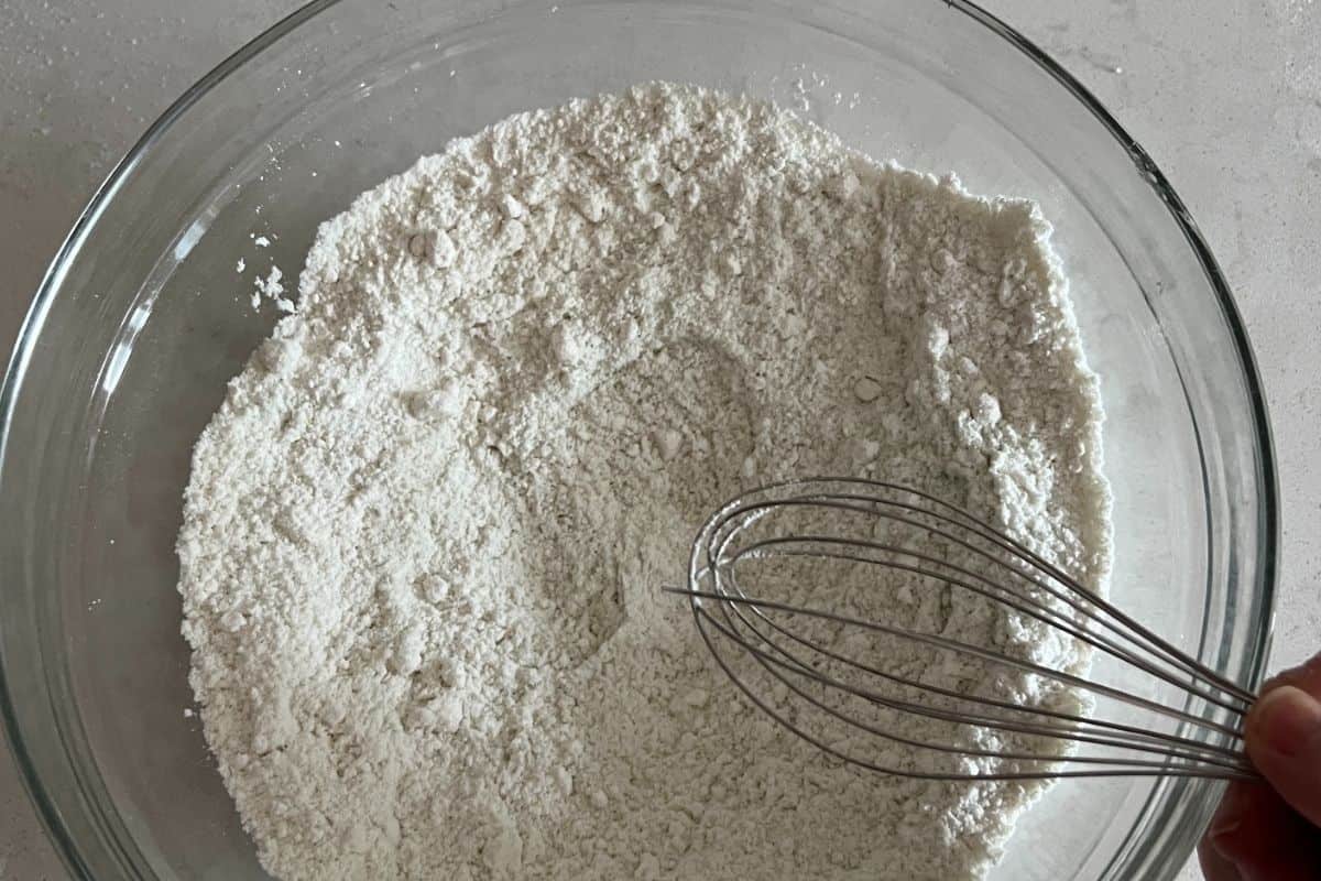 Dry ingredients for key lime cake in bowl.