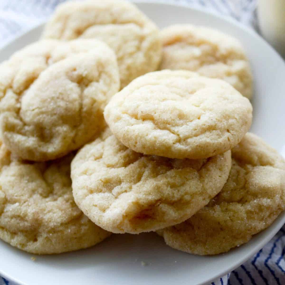 Egg nog snicker doodle cookies on a white plate. 