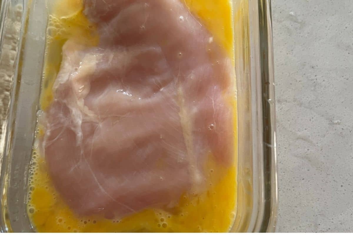 Chicken dipped in egg mixture.