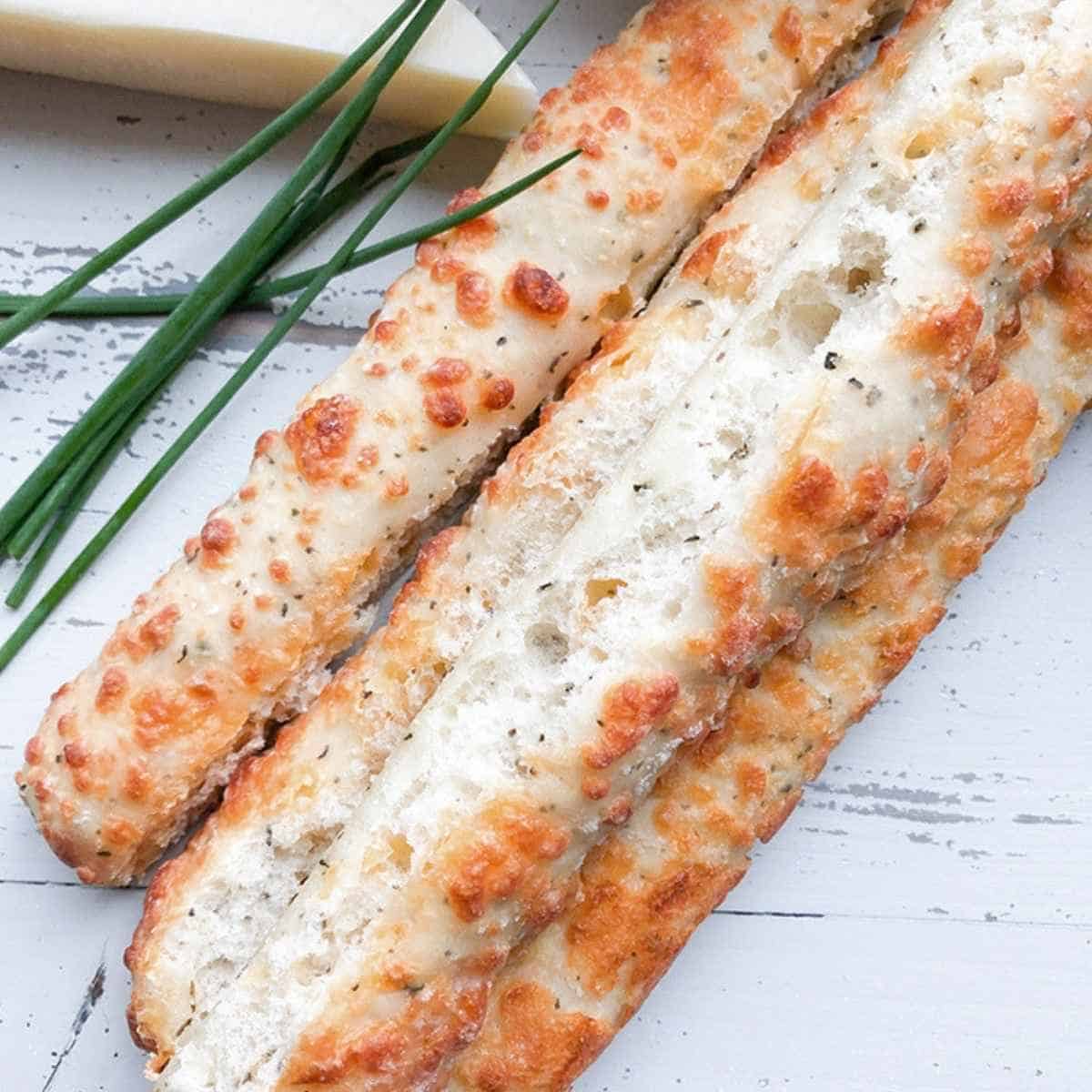 Breadsticks and parmesan cheese. 
