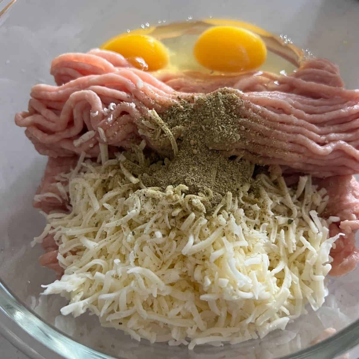 Carnivore pizza crust ingredients in a bowl.