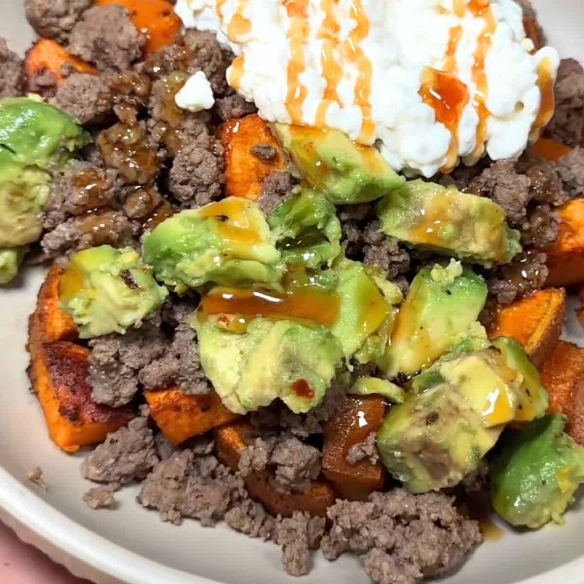 Assembled ground beef and sweet potato bowl.