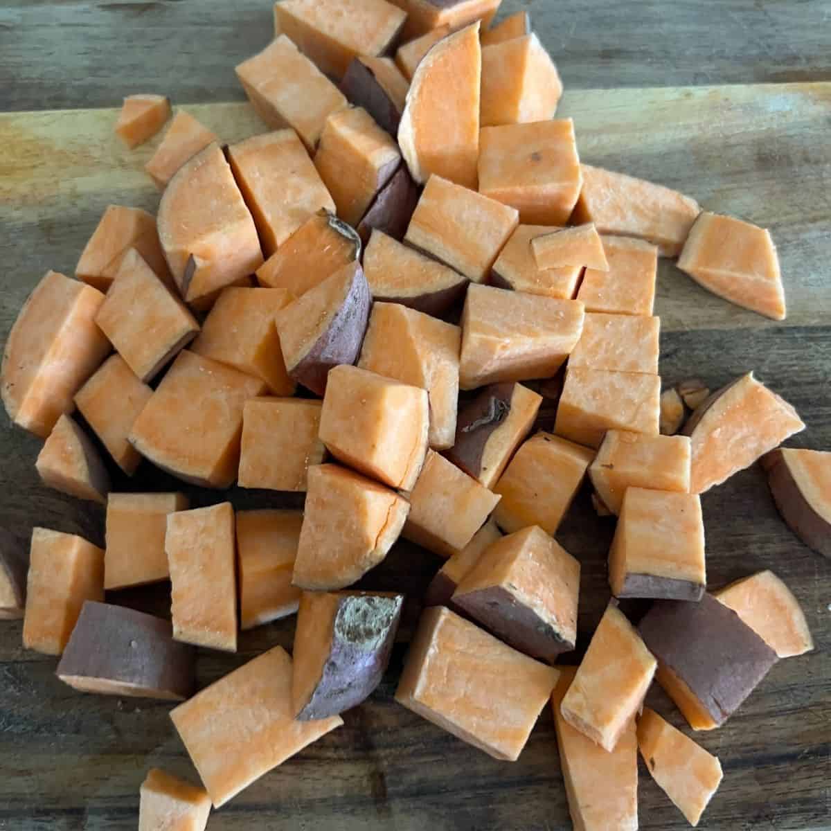 Cubed up sweet potatoes on cutting board