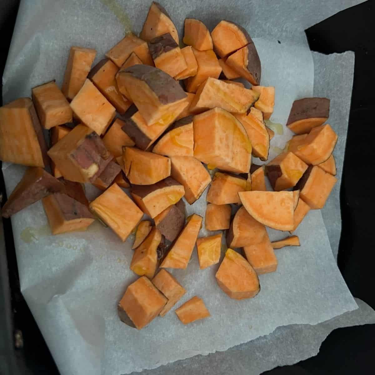 Cubed up sweet potatoes in air fryer.
