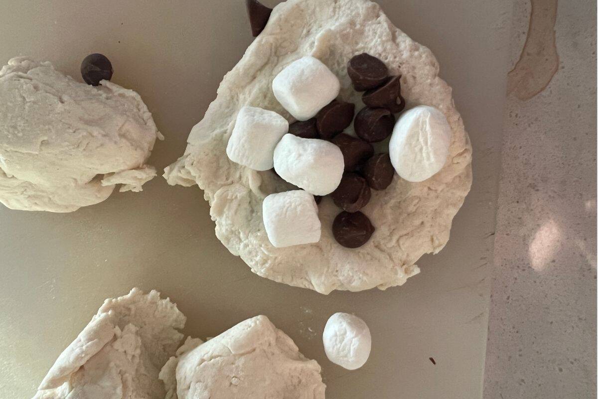 Marshmallows and chocolate chips in 2 ingredient dough.