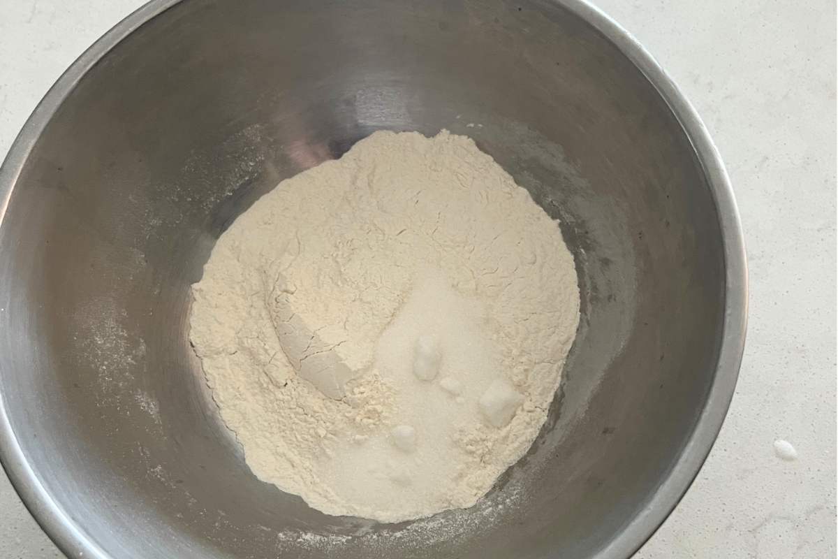 Dry ingredients mixed together for blueberry muffins in a bowl.