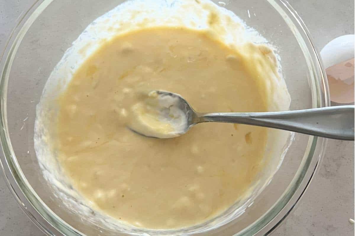 Wet ingredients mixed together for blueberry muffins in a bowl.