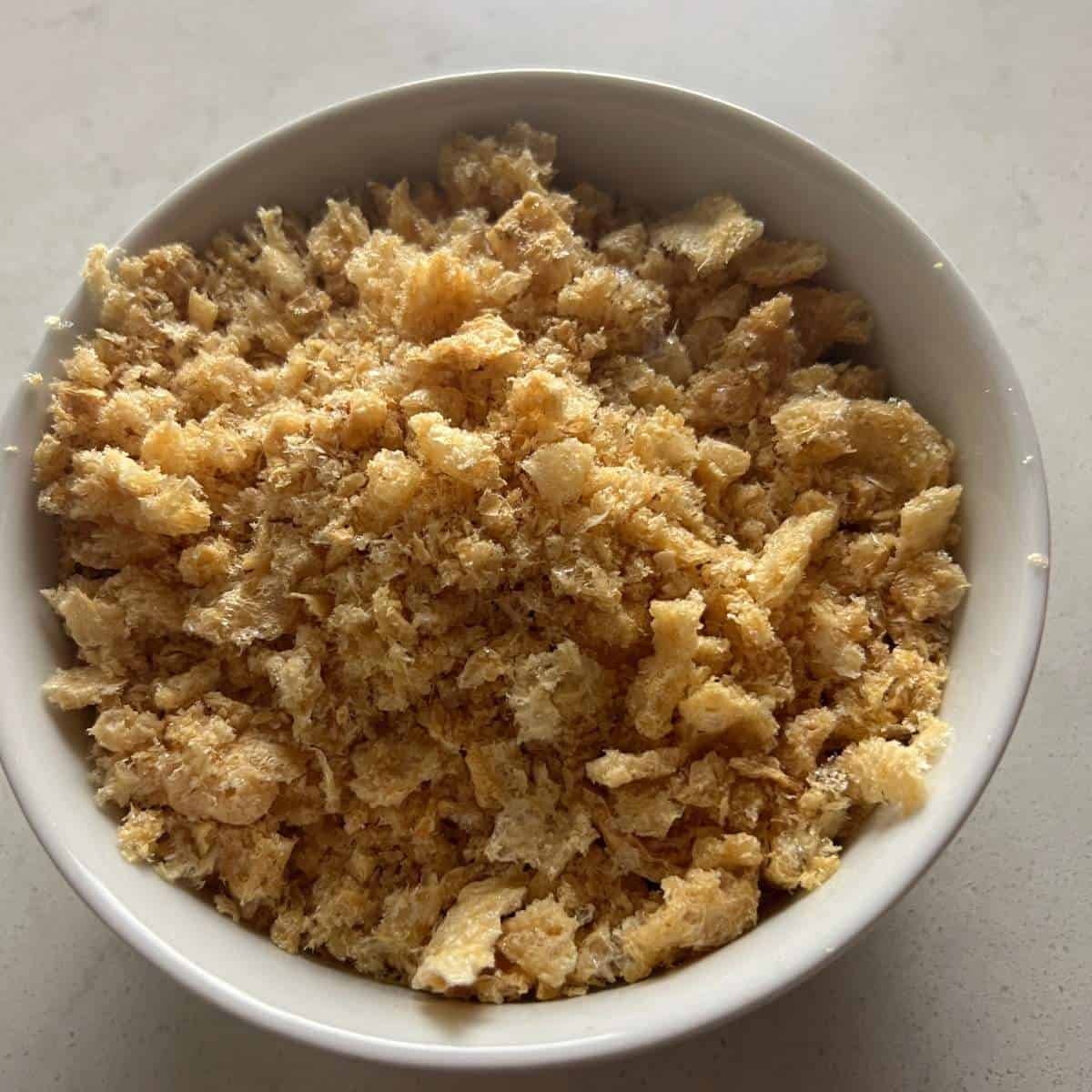 Crushed Pork rinds in a bow.