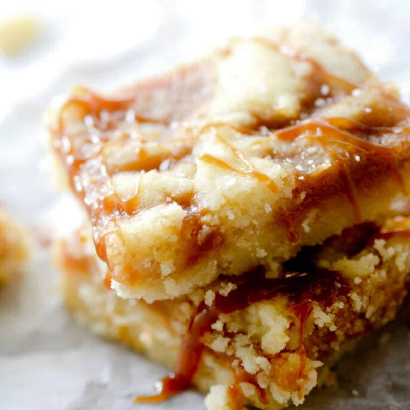 Salted caramel butter bars topped with drizzle caramel and salt.