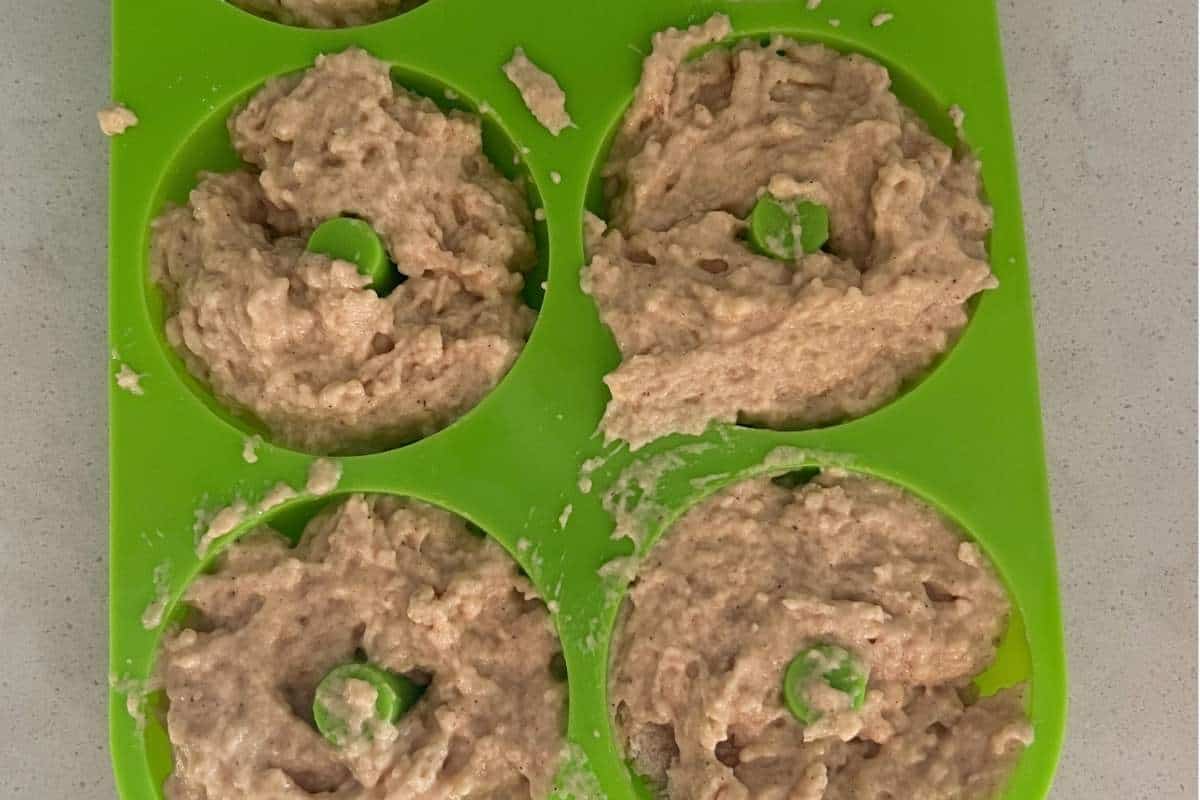 Donut mixture in donut pans.