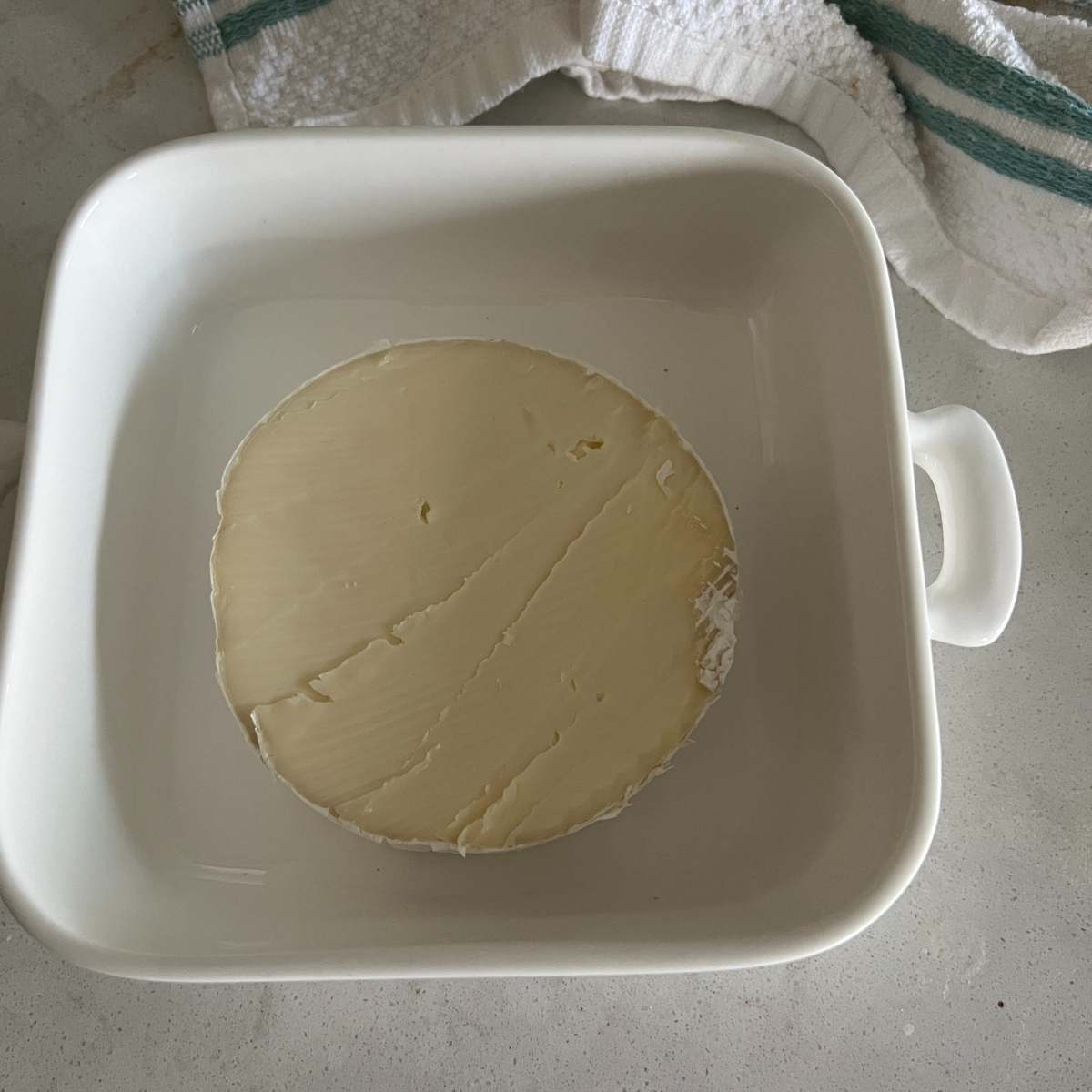 Brie cheese without rind out on top.