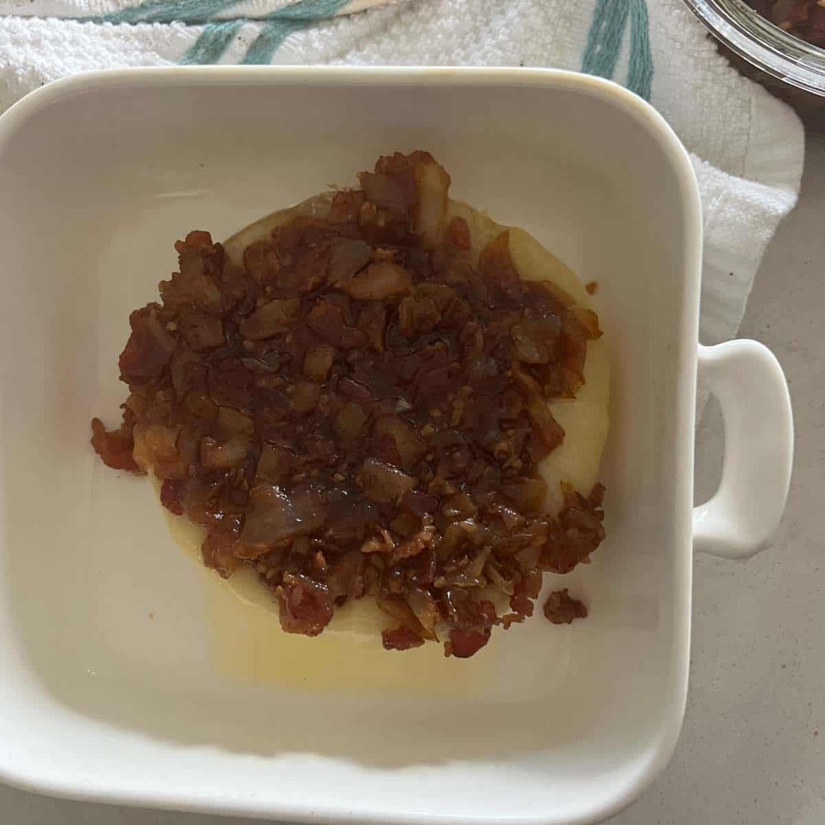 Baked brie topped with bacon onion jam.